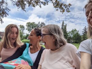 Three generations. One bench. Pure summer joy.